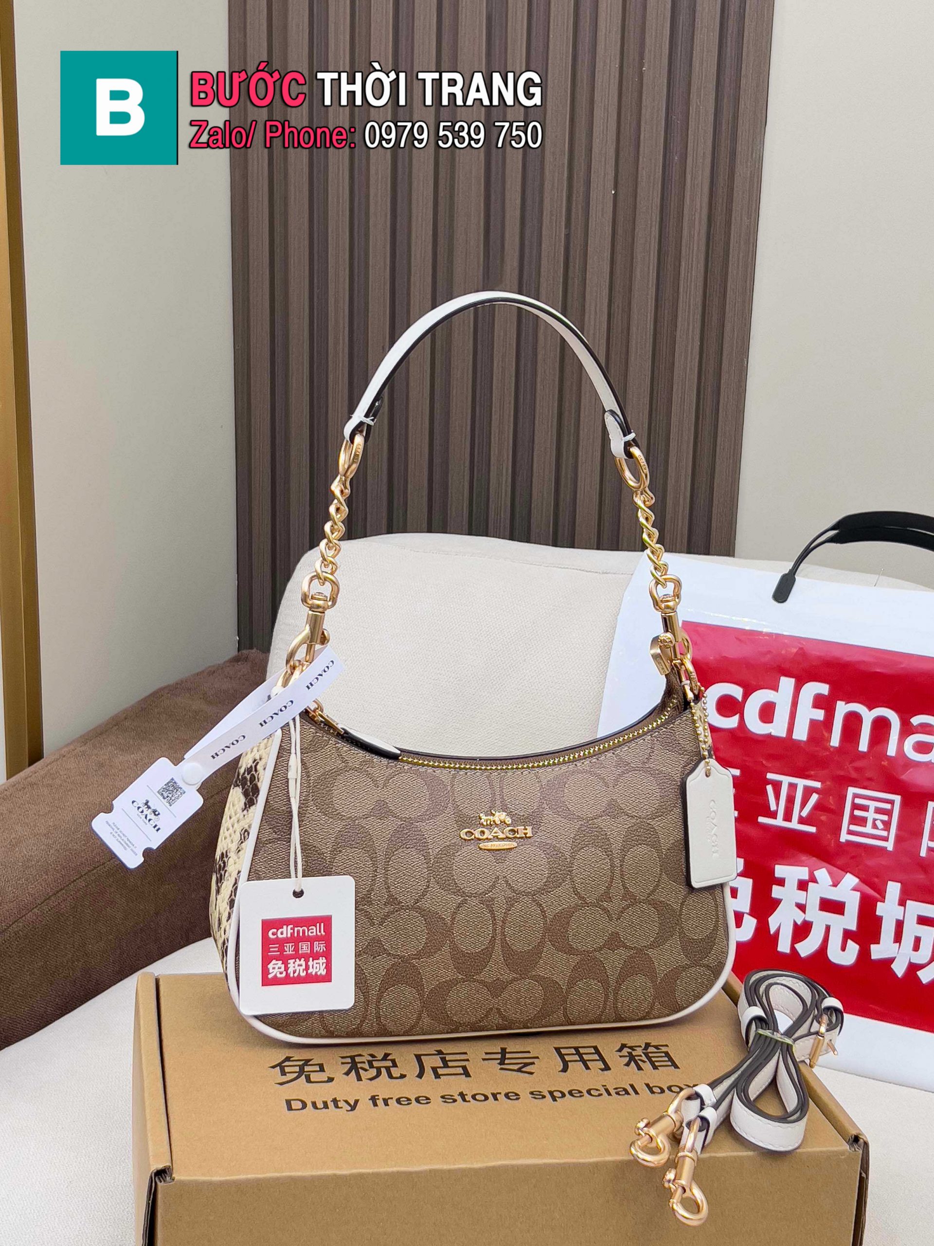 Túi Coach Teri dạng kẹp nách màu nâu viền trắng size 24.5x15.5x7.5 cm