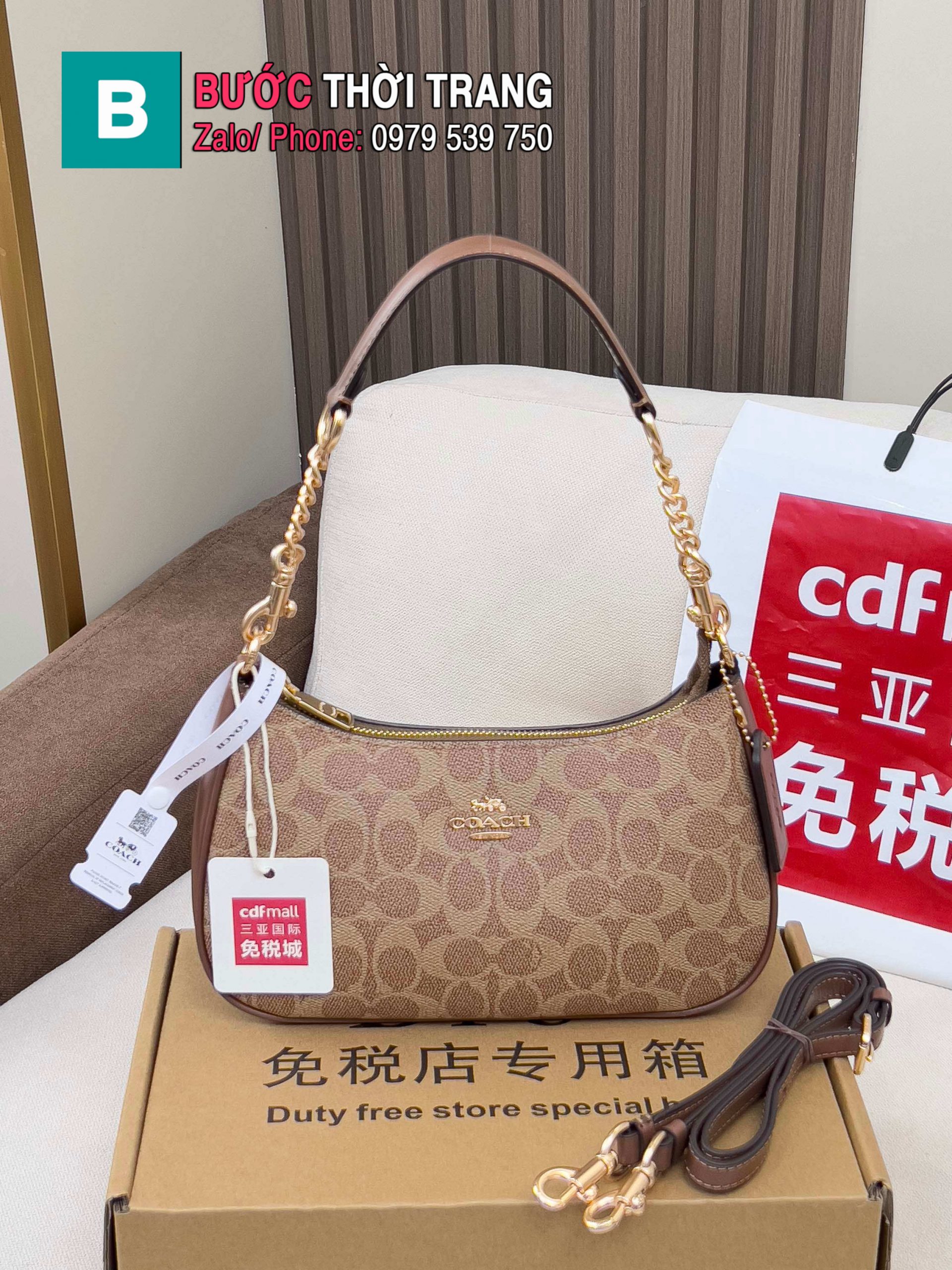 Túi Coach Teri dạng kẹp nách màu nâu size 24.5x15.5x7.5 cm