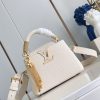 Túi xách LV CAPUCINES màu trắng ngà cao cấp size 21 cm nổi bật với chi tiết tua rua kim loại lấp lánh